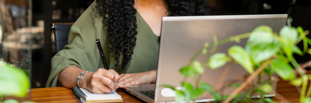 Photographic image of a woman working at a computer