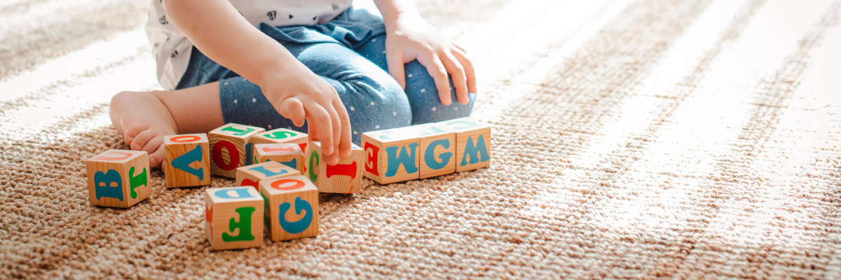 Photographic image of child playing with blocks