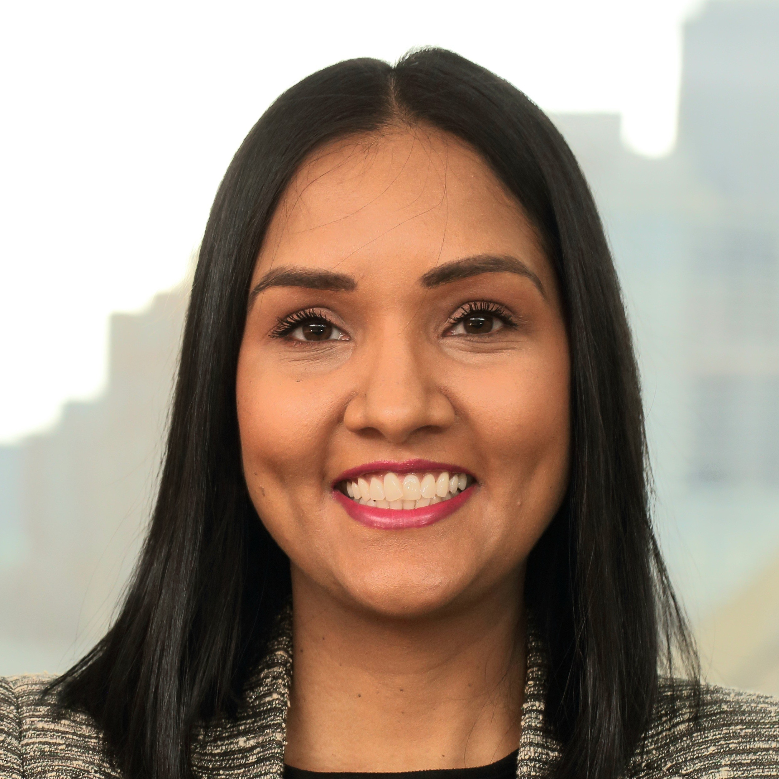 A headshot style image of Kyra Menezes.